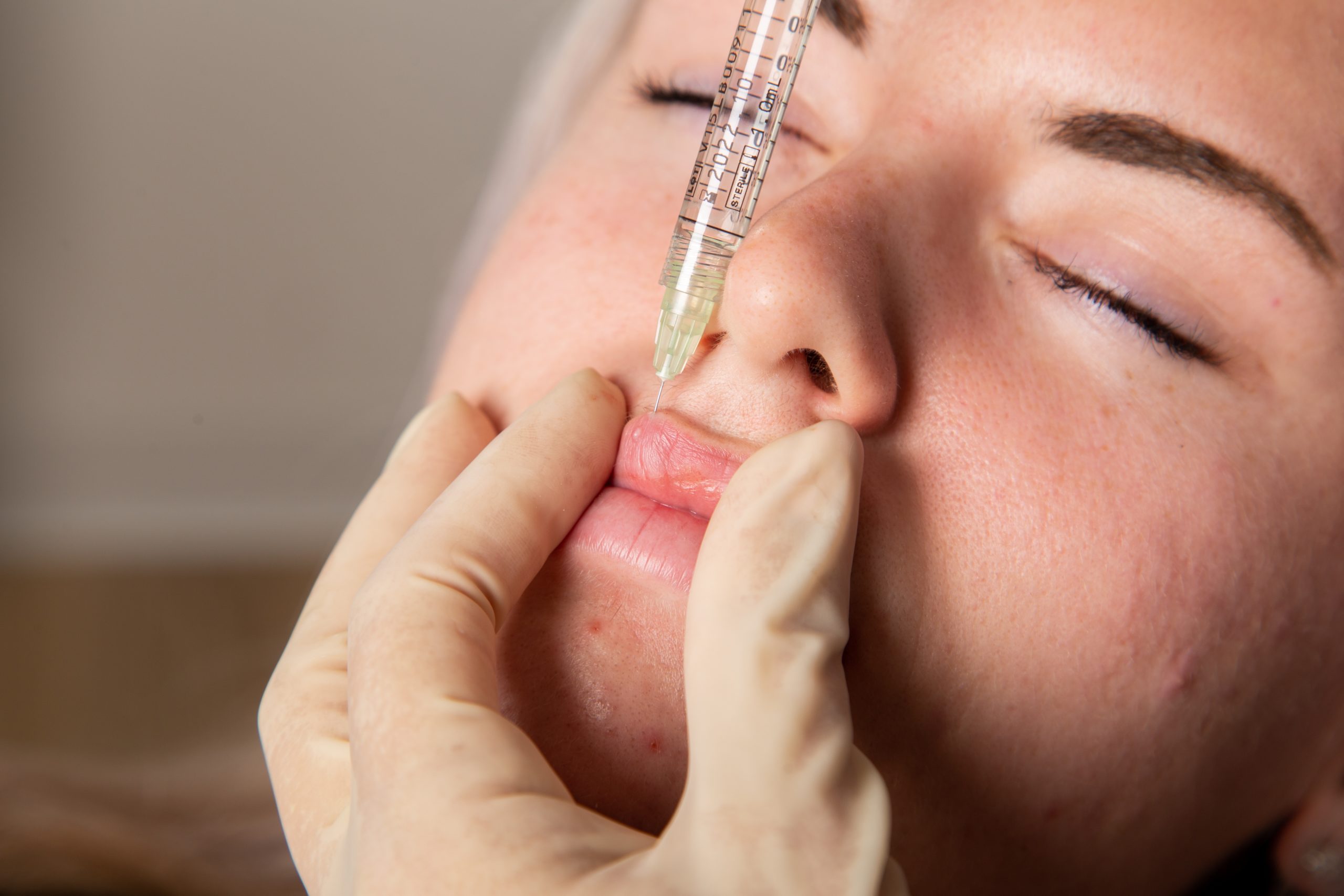 Woman receiving advanced facial therapy at clinic