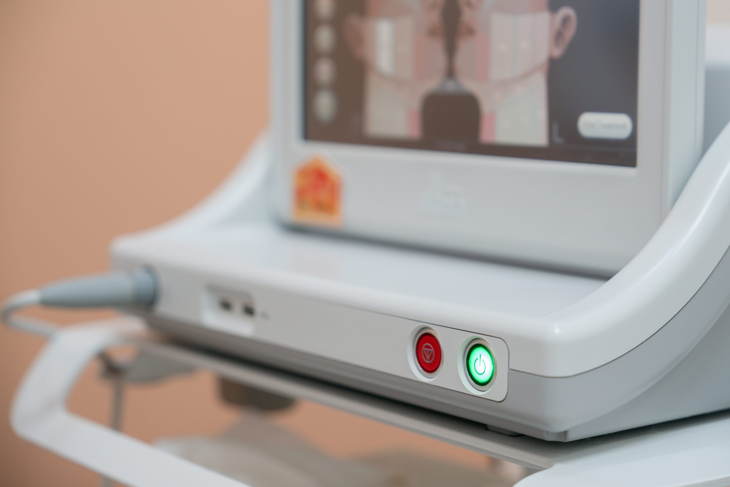 Microneedling pen applied to facial skin